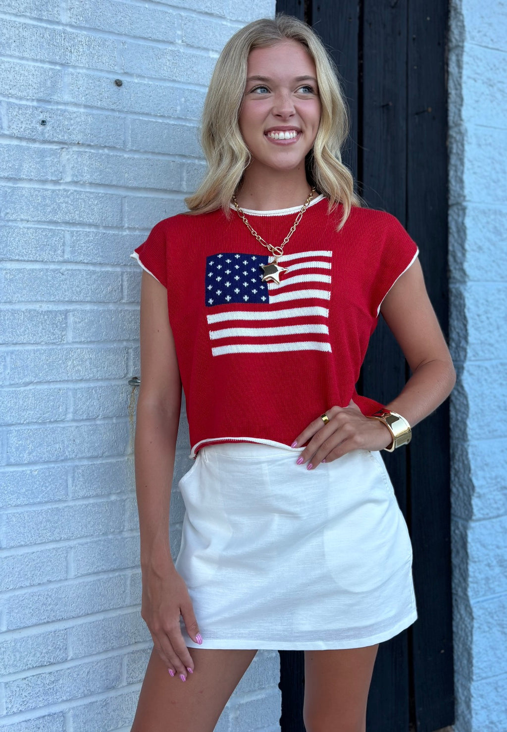 RED FLAG SLEEVELESS GRAPHIC KNIT TOP