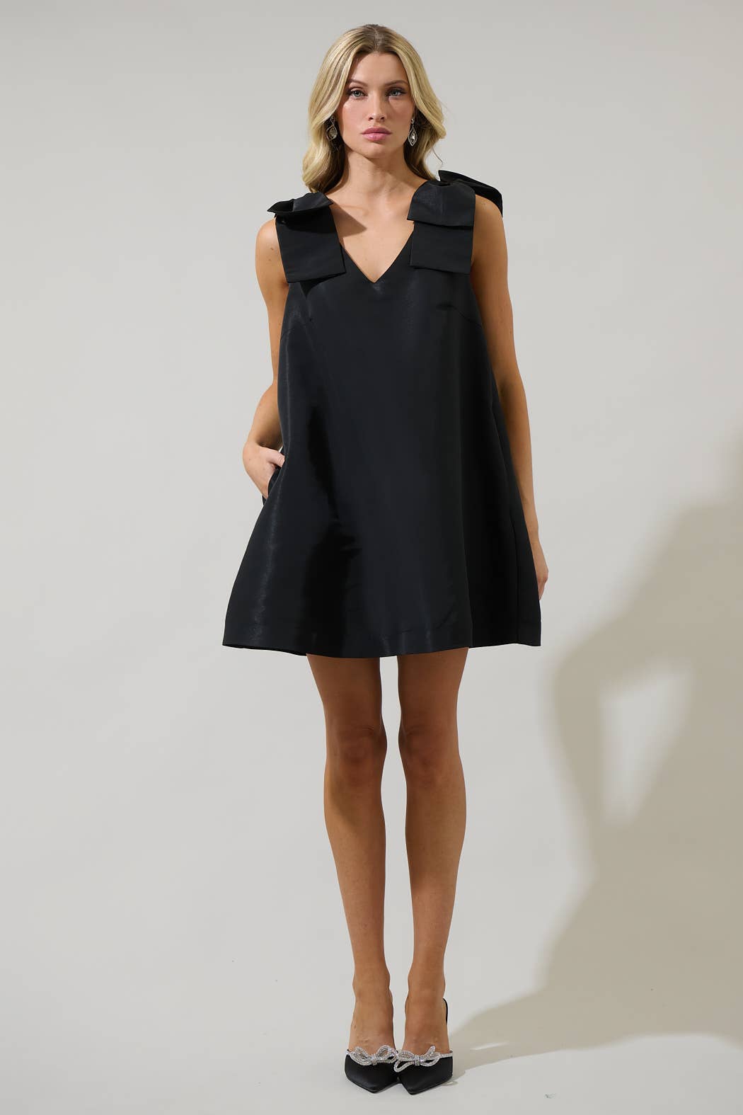 Alani Bow Trapeze Mini Dress: Black BETWEEN THE VINES Alani Bow Trapeze Mini Dress: Black BETWEEN THE VINES