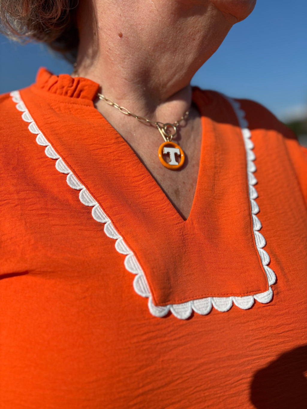 ORANGE/WHITE GAME DAY RUFFLE SLEEVE SCALLOP TRIM TOP